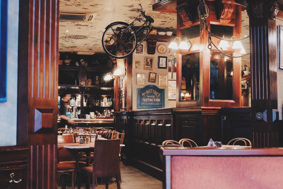A busy restaurant dining room at peak service — the high-revenue half of a seasonal trading year