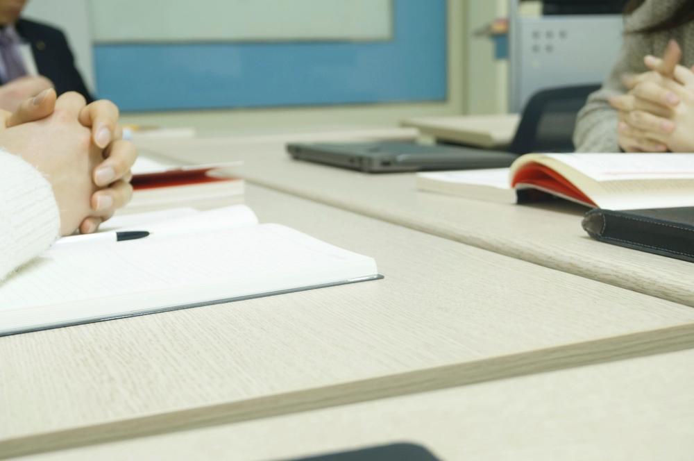 A tidy office desk with a calendar and paperwork, representing company filing deadlines