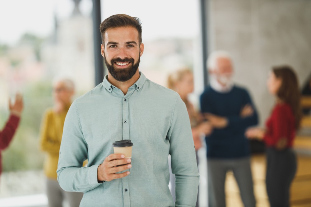 A lender reviewing a company’s figures with care, representing an affordability assessment made by people