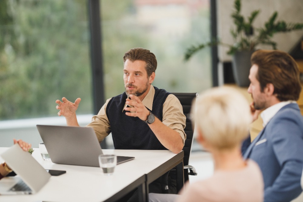 Members of a firm in a meeting, representing an LLP run by its members